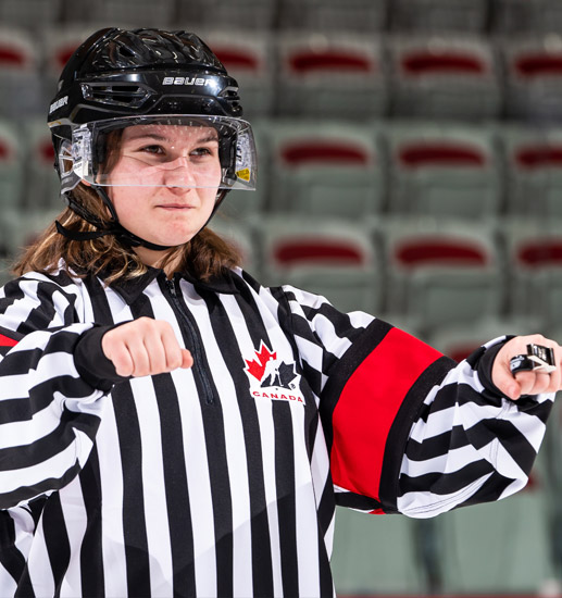 What is cross-checking in hockey?